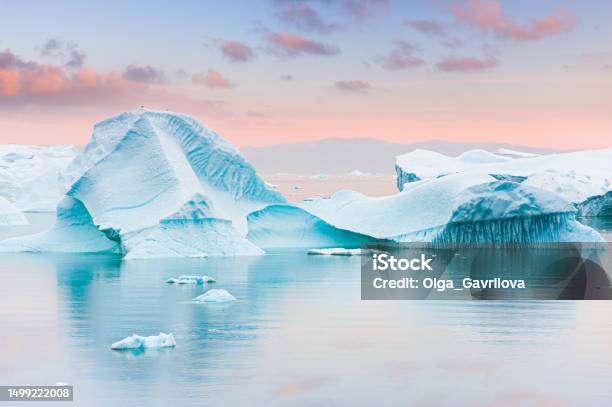 Icebergs In Atlantic Ocean At Sunset Ilulissat Icefjord Western Greenland Stock Photo - Download Image Now