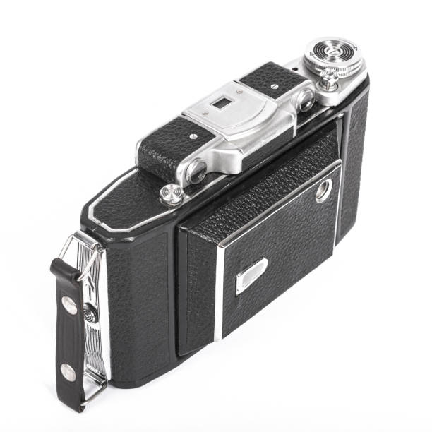 istock Old, antique pocket camera. The black camera is covered with a black leather handle. Front view on a white background 1499222225