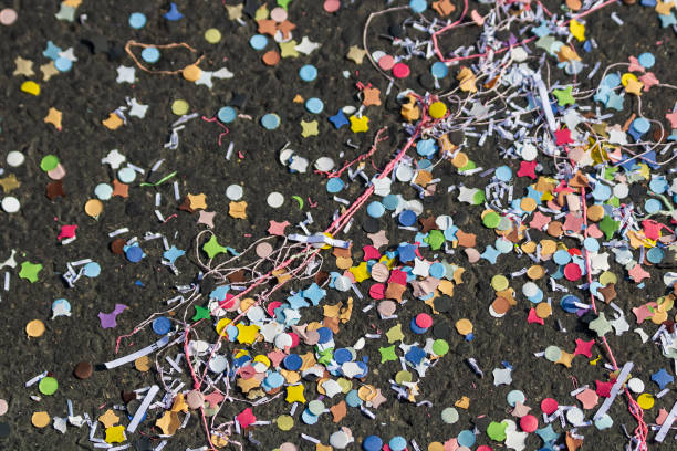 Groupe of people celebrating New Year's Eve and have Happy hour in a bar.  Coworkers and colleagues celebrate with confettis. Multiethnic group from 25 to 45 year’s old. Pictures was taken in Quebec Canada.