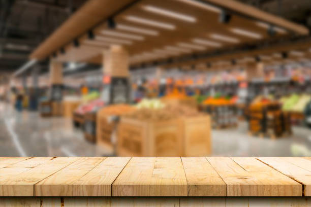 istock Table top counter with Blur Shelf display interior of Retail shop background 1499223801