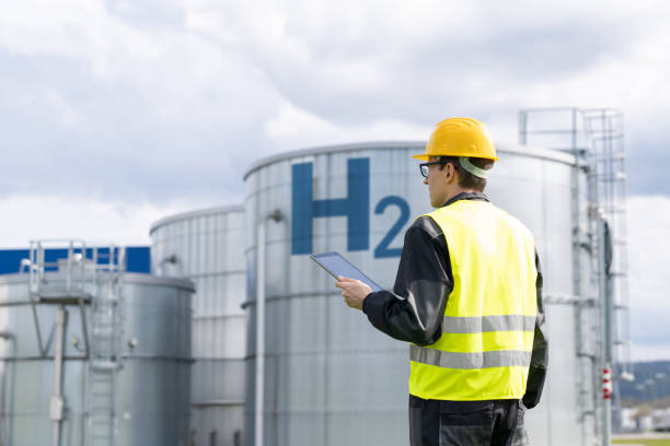 istock Engineer on a background of Hydrogen factory 1499230475