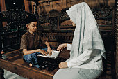 A Malay Muslim Mother Teaches Her Son To Read the Quran