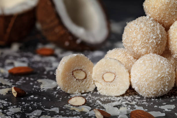 istock Cut and whole coconut candy and coconut on a gray background 1499231708