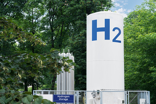 Hydrogen storage tank in a forest. Green energy concept