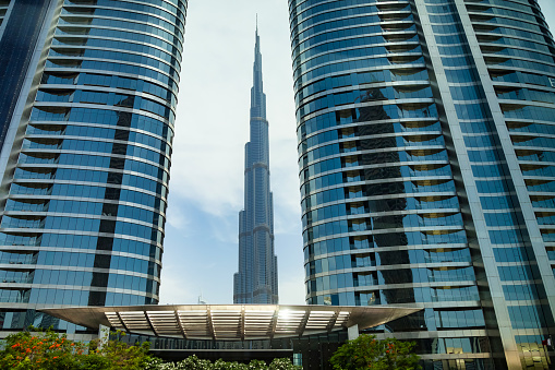 dubai city skyline under blue sky, united arab emirates.