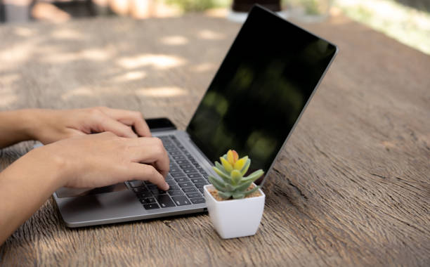 istock The busy businessman efficiently manages his work by skillfully utilizing his laptop, mobile phone, and calculator, seamlessly transitioning between devices to handle tasks and crunch numbers,close up 1499237741