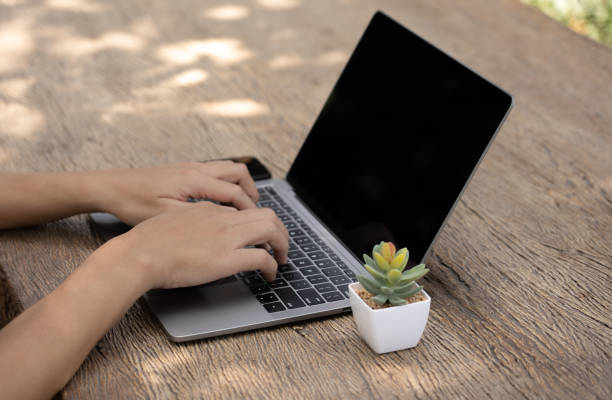 istock The busy businessman efficiently manages his work by skillfully utilizing his laptop, mobile phone, and calculator, seamlessly transitioning between devices to handle tasks and crunch numbers,close up 1499237751