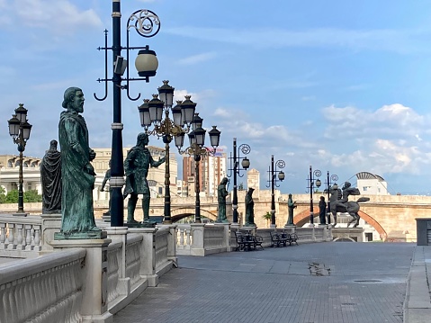 Pont Alexandre III bridge balustrade with Eiffel tower view in Paris, sunny morning