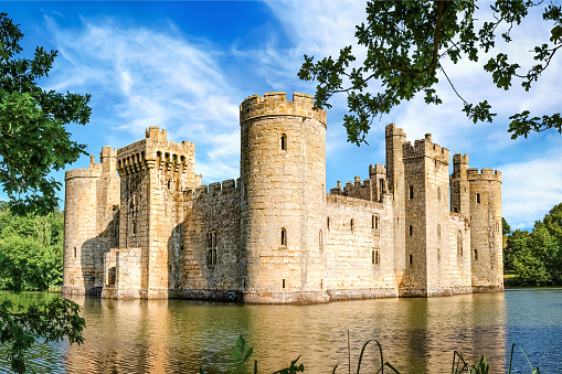 Sussex, United Kingdom - July 9, 2013: View of moated castle Bodiam near Robertsbridge on a sunny day. It was built in 1385.