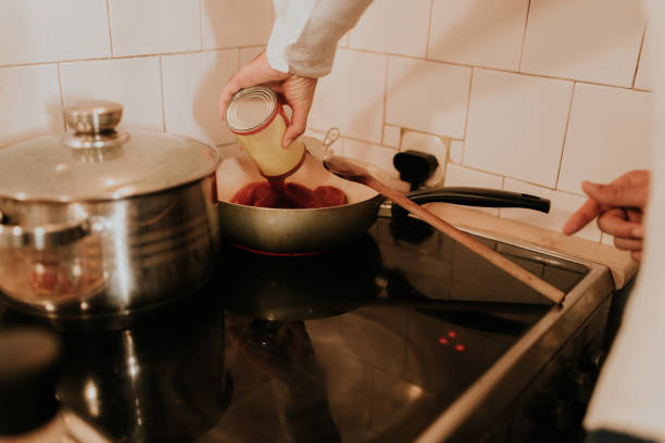 istock Pouring A Pasta Sauce In A Pot 1499241319