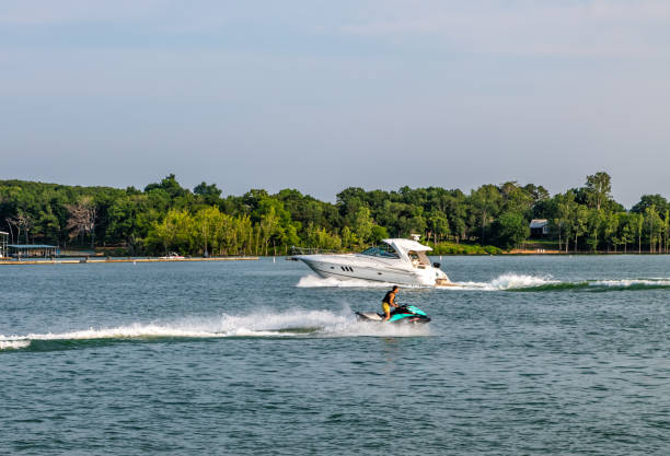 Branson, Missouri, USA. 4 June 2023. Boat and jetski on Table Rock Lake