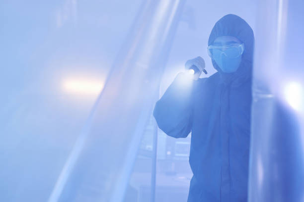 istock Worker wearing full protective suit entering biohazard danger zone 1499247675