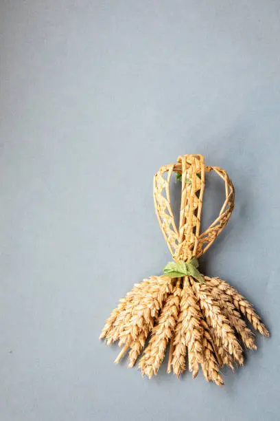 Handmade English 'Ric Rac Chain Dolly' corn dolly also known as 'Corn Mothers', 'Corn Dolls' or 'Corn Maidens' made from wheat to celebrate the harvest being completed.