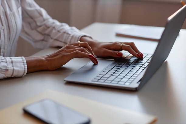 istock Side view black woman using laptop female hands typing at keyboard 1499252743