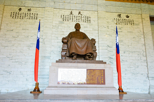 TAIPEI, TAIWAN, APRIL 16, 2023: The great giant bronze statue of Chiang Kai-shek in the main chamber of the Chiang Kai-shek Memorial Hall, Taipei, Taiwan