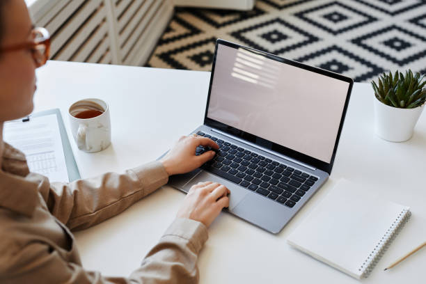 istock Unrecognizable businesswoman using laptop 1499253598