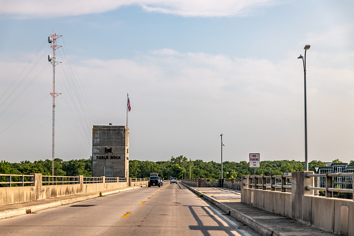 The pier of the bridge over the river looking up from below