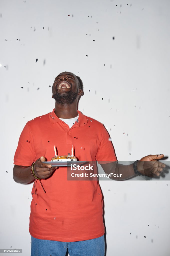 Happy Black Man Holding Birthday Cake With Confetti Stock Photo Happy Black Man Holding Birthday Cake With Confetti Stock Photo