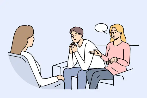 Vector illustration of Couple at family therapist in office, sitting on couch talking about problems and quarrels