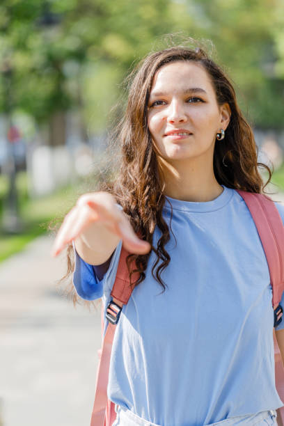istock Girl extends a hand to meet 1499263425