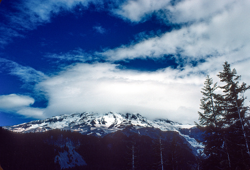 Mt Rainier NP - Mt Rainier & Scattered Clouds - 1979. Scanned from Kodachrome 64 slide.
