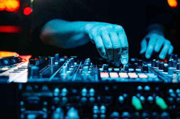 istock DJ Hands creating and regulating music on dj console mixer in concert 1499275892