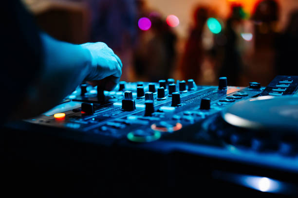 istock DJ Hands creating and regulating music on dj console mixer in concert 1499275893