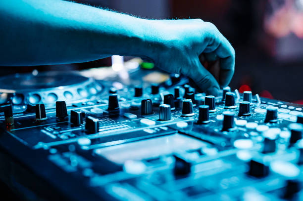 istock DJ Hands creating and regulating music on dj console mixer in concert 1499275895