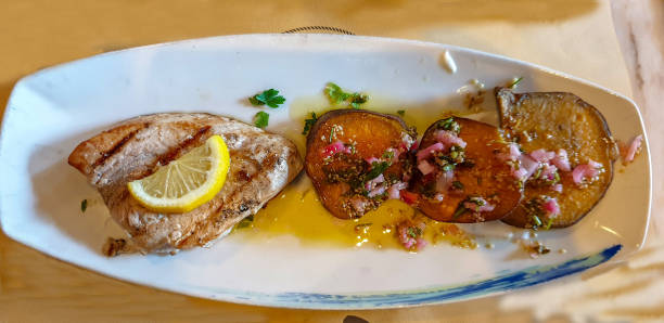 istock Grilled tuna fillet with red potatoes 1499276275
