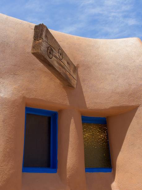 istock Modern design of a traditional adobe structure with blue sky 1499277697