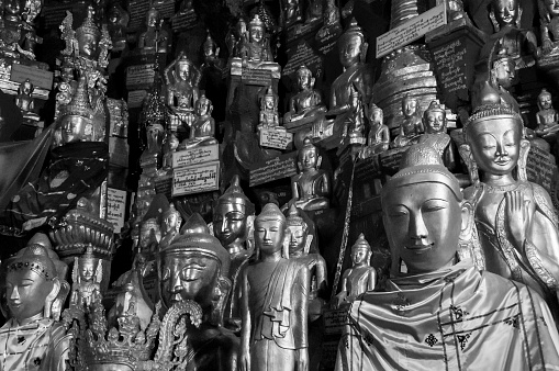 Pindaya, Shan State, Myanmar - nov 8, 2012: hundreds of votive Buddha's stutues literally fill the Pindaya Caves. Each is a votive offering of a faithful grateful for a grace.