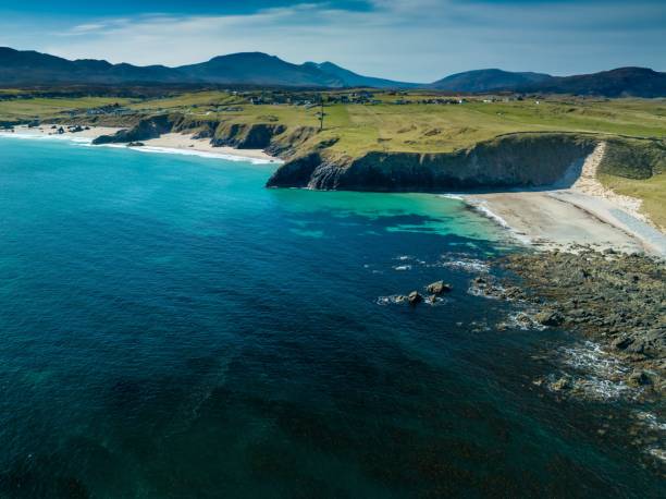 istock an aerial view of a sandy beach and blue waters with grass on either side 1499283753