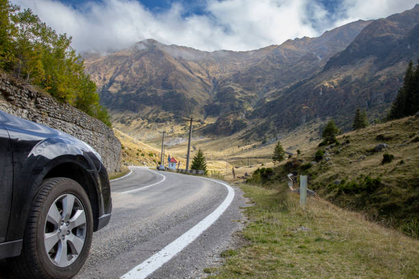 istock Mountain Road Trip Through Scenic Landscape with Blue Sky and Rolling Clouds 1499286525