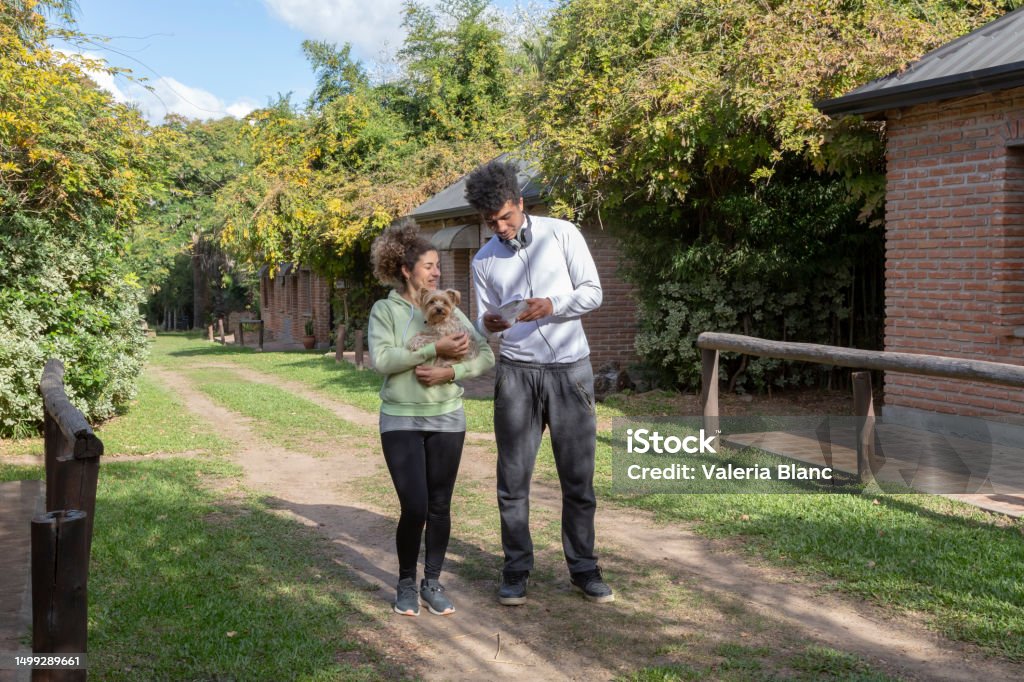 couple with pet outdoors couple with Yorkshire 20-24 Years Stock Photo