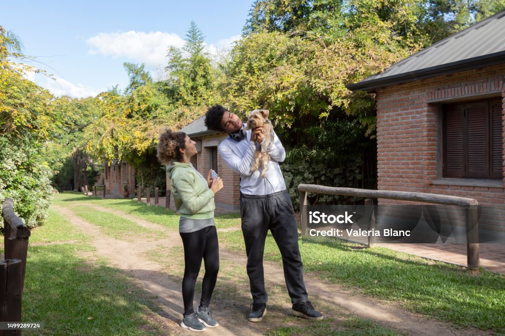 couple with pet outdoors couple with Yorkshire 20-24 Years Stock Photo
