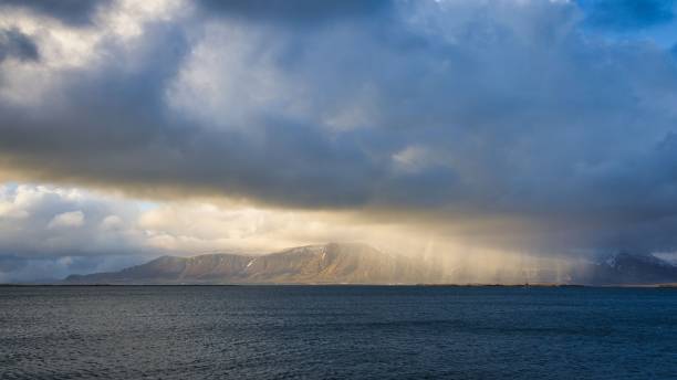 istock Stunning and dramatic aerial view the sky and rain streaming in from the distant ocean 1499290649