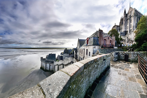 A pictoresque angle of the Mont Saint Michel, in north of France, with the view of the low tide from the ramparts