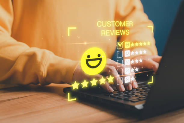 istock Customer using a computer laptop with pop up smile face and five star icon for assessment feedback review satisfaction and testimonial. Customer service experience and business satisfaction survey. 1499307440