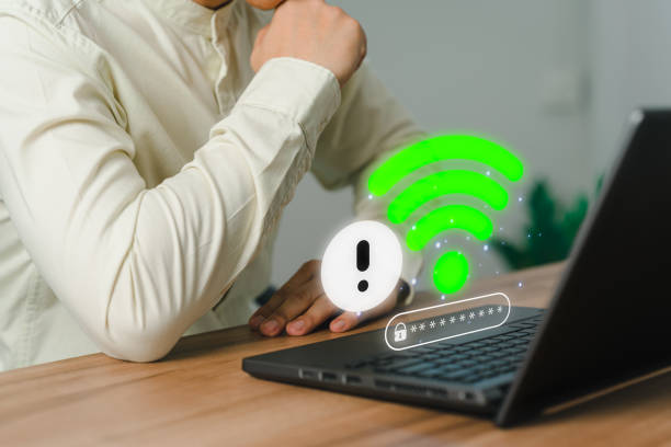 istock User man using a computer laptop to connect to wifi but wifi not connected or password is incorrect and waiting to loading digital data form website, concept technology of waiting for connect to wifi. 1499307930