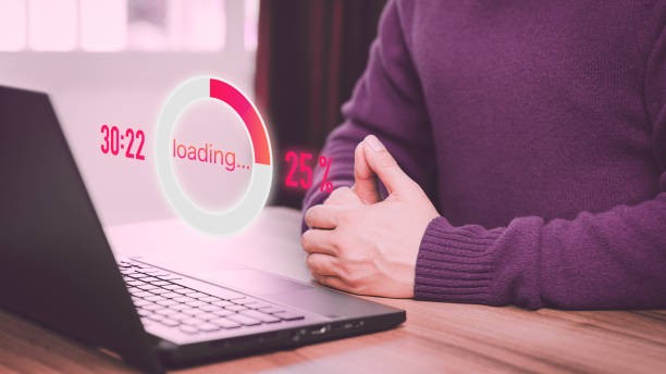 istock Adult man using a laptop computer for download and update software and waiting to loading digital file data form website, very slow internet form wifi. Concept of waiting for load of loading symbol. 1499309027