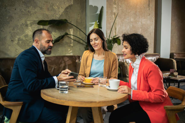 istock Three colleagues on a business coffee 1499310188