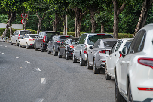 Long queues of cars on the roadside