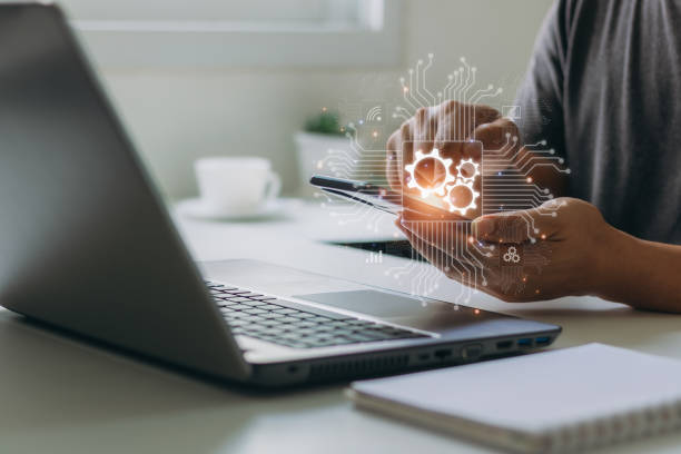 istock Businessman using a smartphone to remote control business industrial process automation software RPA technology concept. Automation Software Technology Process System Business Concept. 1499317938