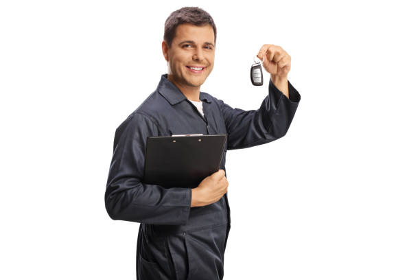 istock Auto mechanic holding a clipboard and car keys 1499318210