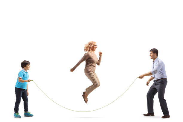 istock Mother, father and son playing skipping rope 1499318238