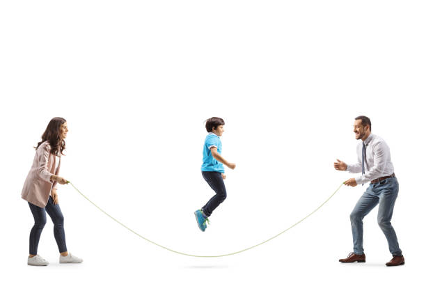 istock Mother and father playing skipping rope with son 1499318725