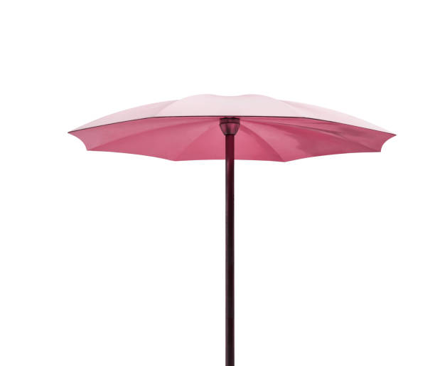 Pink beach umbrella isolated cutout on white background