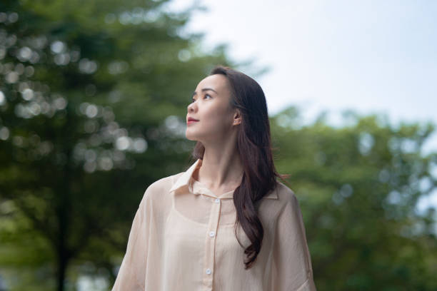 istock Young asian woman walking in a park 1499321972