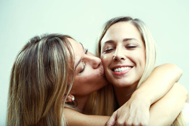 istock Friendly blondes, tender cuddles, cheek kisses 1499322493