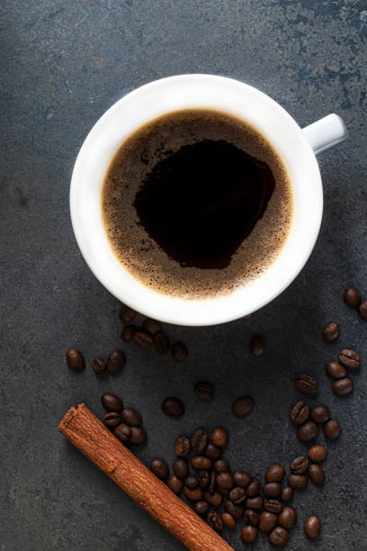 istock Espresso coffee morning homemade has bean dark on stone table. 1499325255